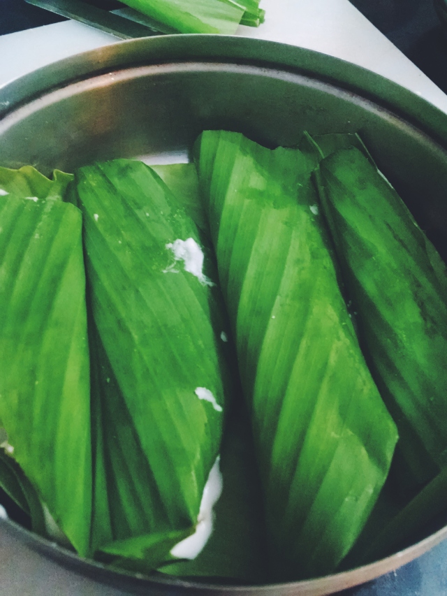 Place the prepared leaf into the lined pan and once you've filled the pan, steam it for 8-10 minutes.
